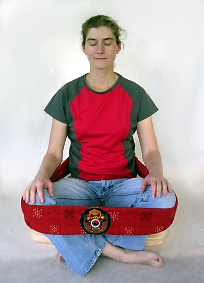 Sitting with a gomtag (meditation strap)